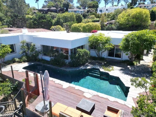 a aerial view of a house with garden