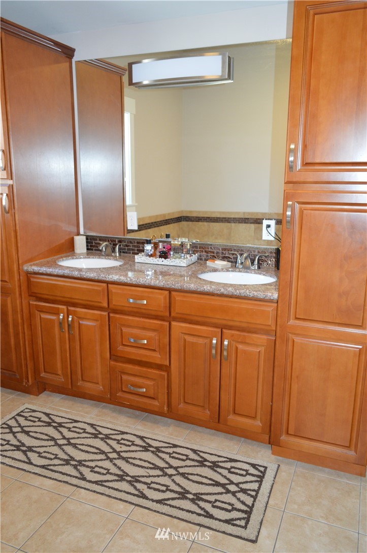 6760 Old Guide Road Lynden, WA 98264 - Photo 8 of 37 a bathroom with a sink a vanity and a mirror