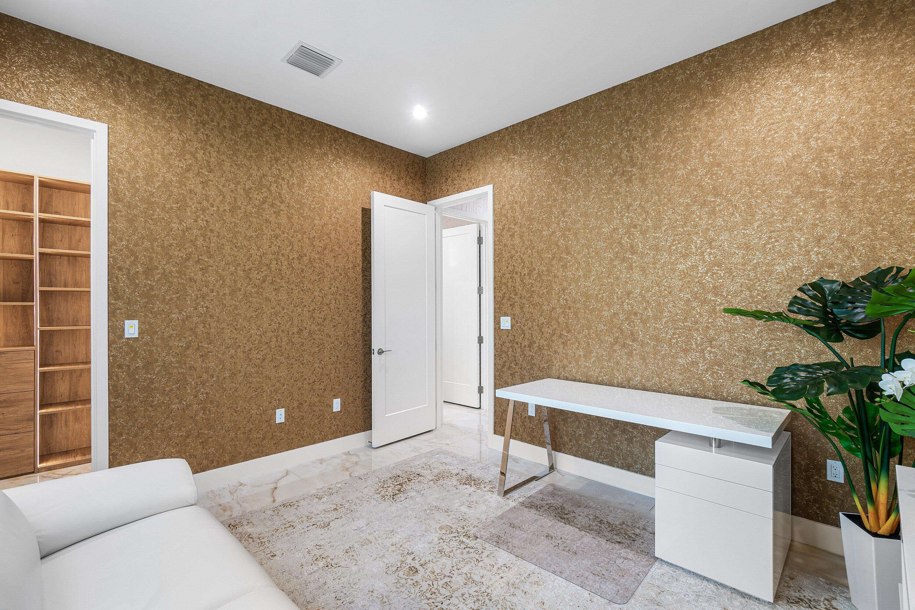 8233 Crystal Downs Avenue Boca Raton, FL 33434 - Photo 24 of 58 a hallway with a bench and a potted plant