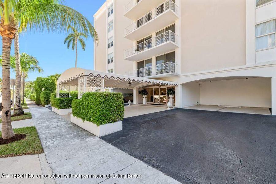 354 Chilean Avenue, Unit 6E Palm Beach, FL 33480 - Photo 16 of 16 a front view of a building with garden
