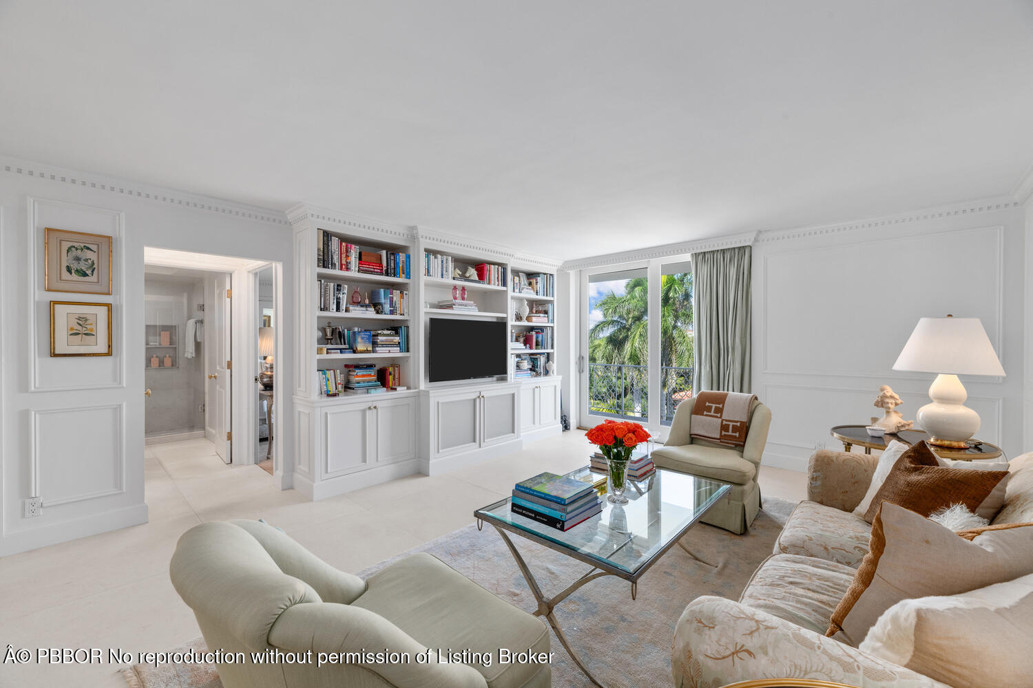 354 Chilean Avenue, Unit 6E Palm Beach, FL 33480 - Photo 2 of 16 a living room with furniture a flat screen tv and a large window