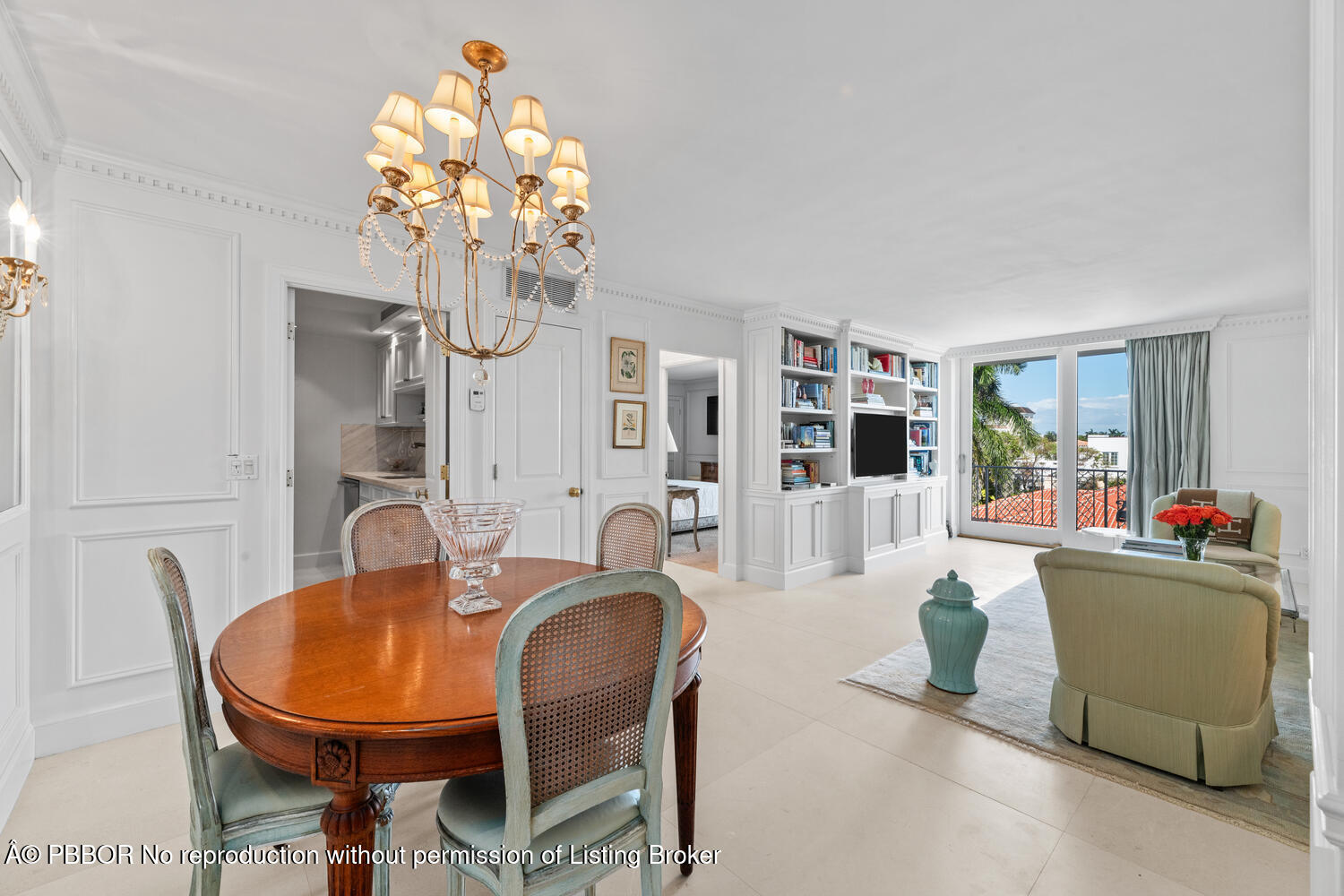 354 Chilean Avenue, Unit 6E Palm Beach, FL 33480 - Photo 5 of 16 a living room with furniture and a chandelier