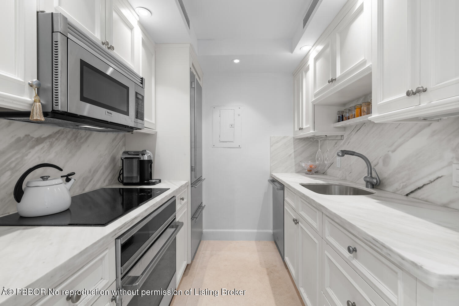 354 Chilean Avenue, Unit 6E Palm Beach, FL 33480 - Photo 7 of 16 a kitchen with stainless steel appliances granite countertop a sink and a stove top oven