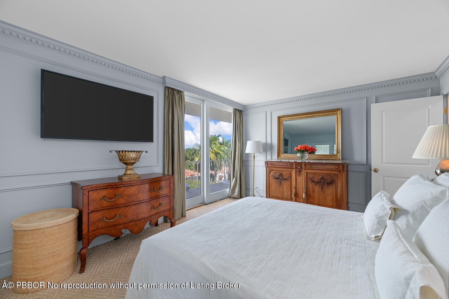 354 Chilean Avenue, Unit 6E Palm Beach, FL 33480 - Photo 10 of 16 a bedroom with a bed and a flat screen tv