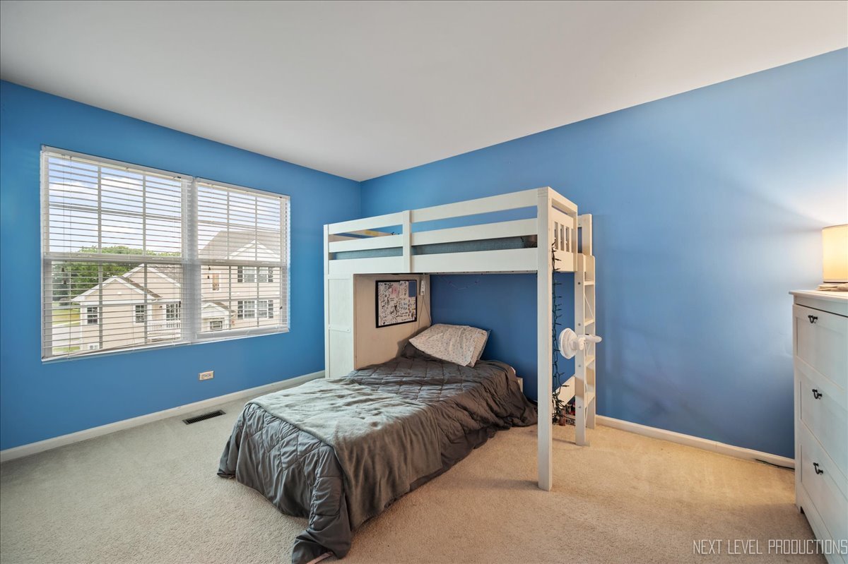 3765 Bailey Road Yorkville, IL 60560 - Photo 16 of 27 a bedroom with a bed and window