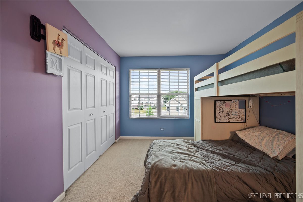 3765 Bailey Road Yorkville, IL 60560 - Photo 17 of 27 a bedroom with a bed and a large window