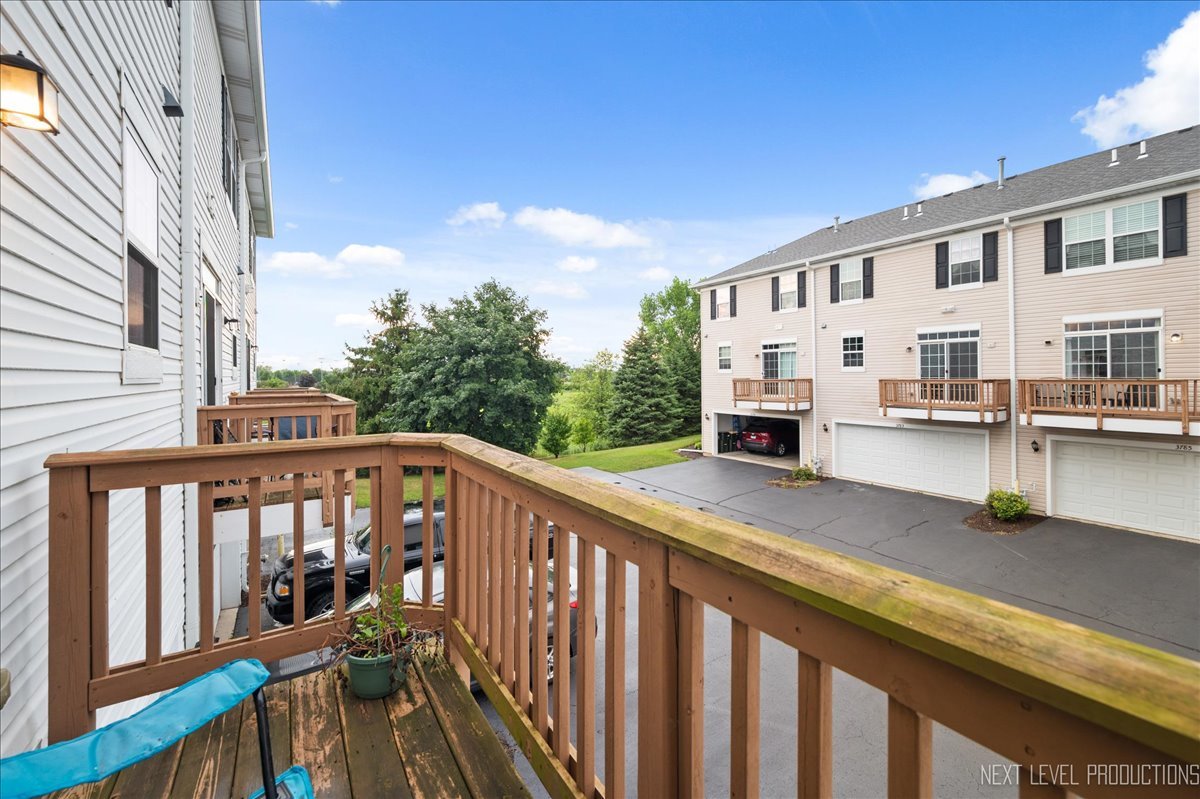 3765 Bailey Road Yorkville, IL 60560 - Photo 21 of 27 a view of a balcony with chairs