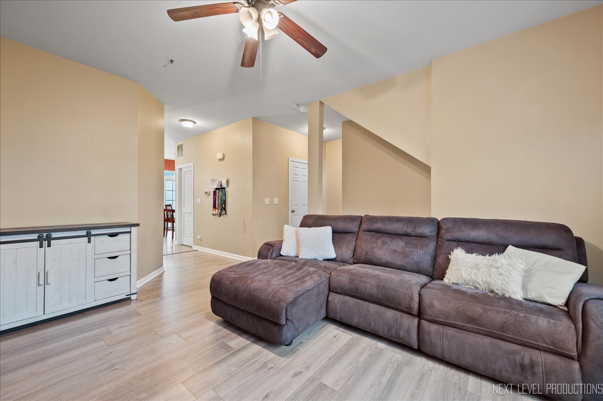 3765 Bailey Road Yorkville, IL 60560 - Photo 5 of 27 a living room with furniture and a wooden floor