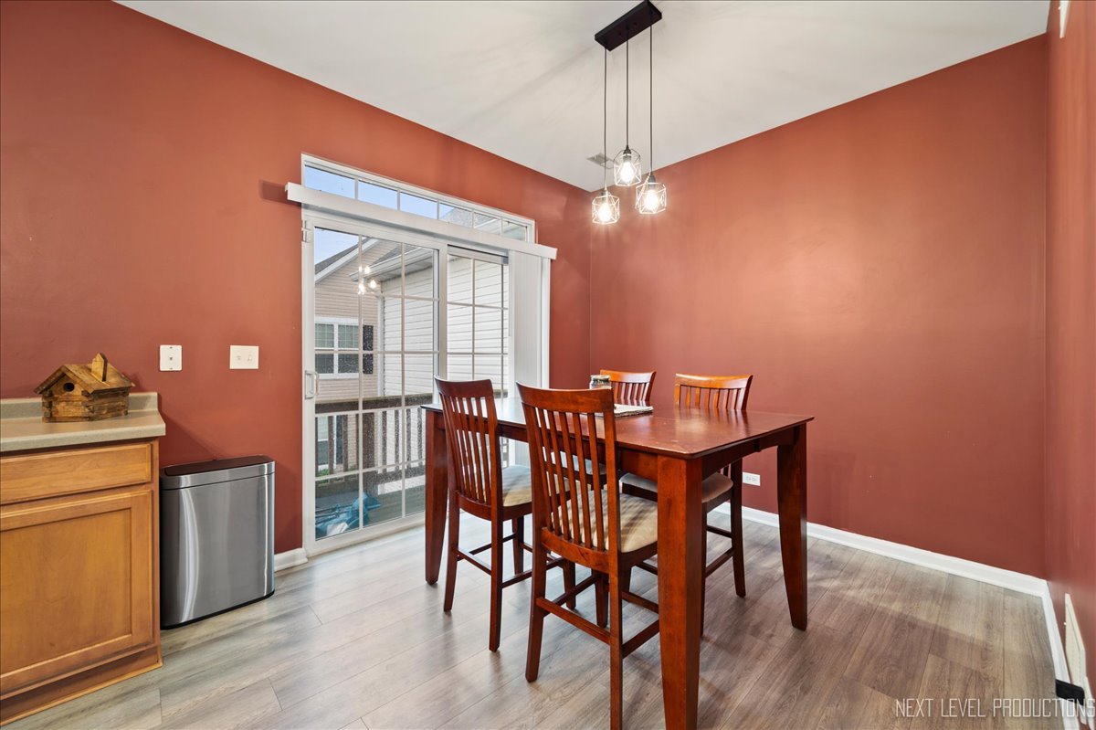 3765 Bailey Road Yorkville, IL 60560 - Photo 9 of 27 a view of a dining room with furniture window and wooden floor
