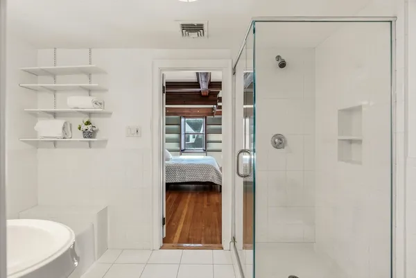 a bathroom with a shower and a toilet