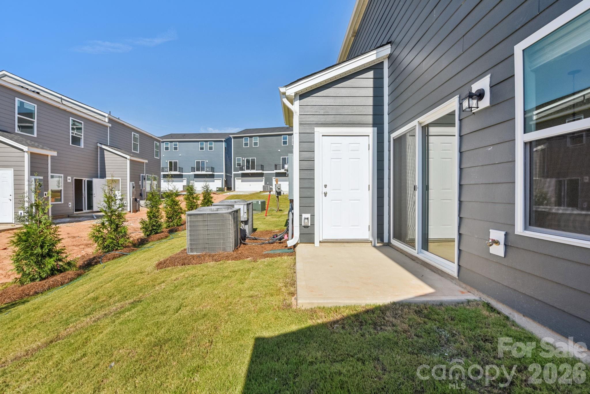 445 Markridge Loop Fort Mill, SC 29708 - Photo 13 of 13 a view of a house with backyard and sitting area