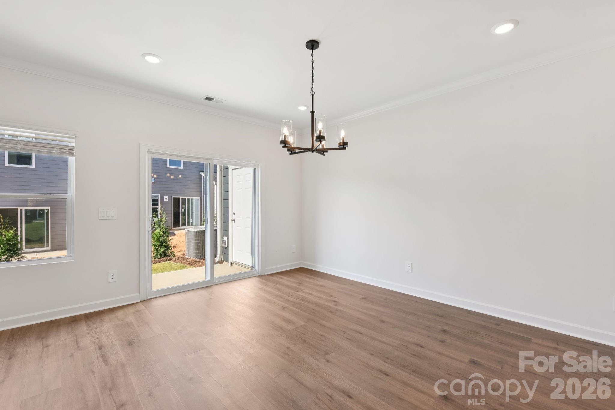445 Markridge Loop Fort Mill, SC 29708 - Photo 2 of 13 a view of empty room with wooden floor and ceiling fan