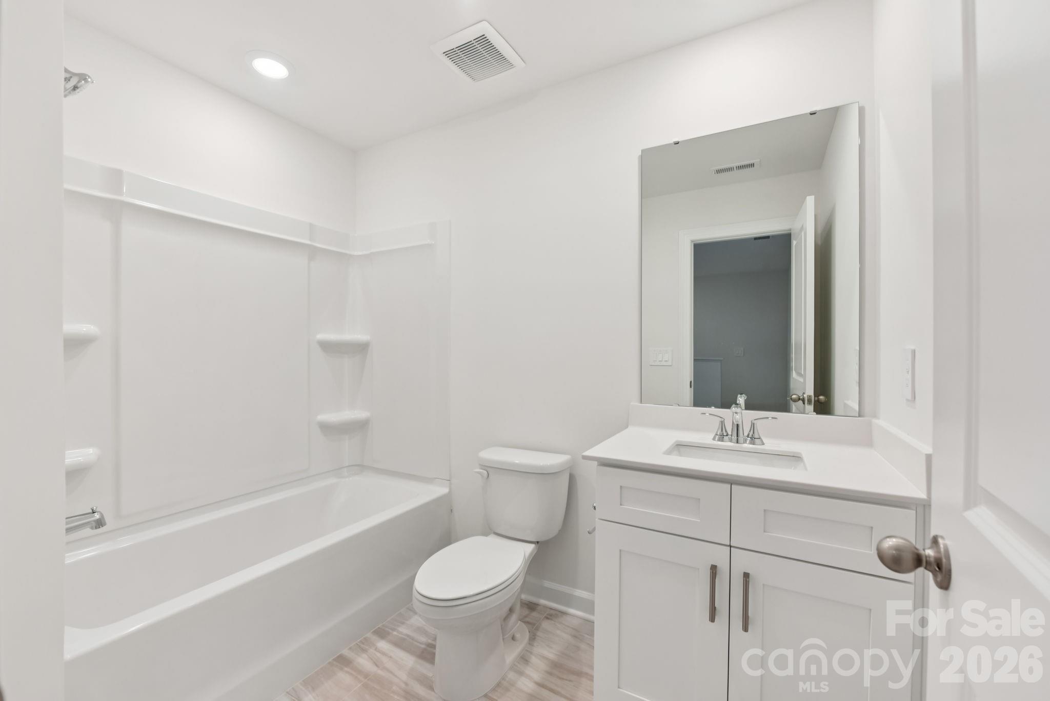 445 Markridge Loop Fort Mill, SC 29708 - Photo 10 of 13 a bathroom with a sink a toilet and shower