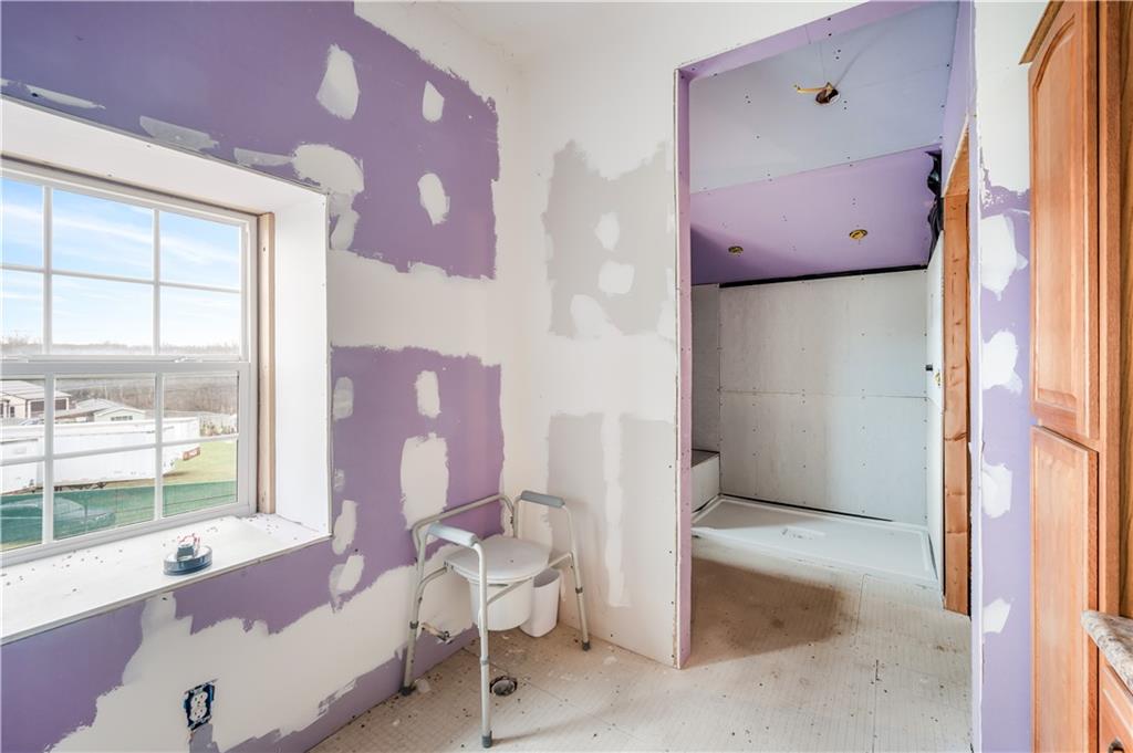 2158 Mercer Road Fredonia, PA 16124 - Photo 11 of 50 a spacious bathroom with a tub shower and a sink