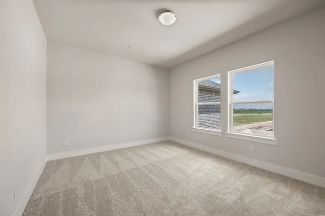 a bathroom with a shower sink and mirror