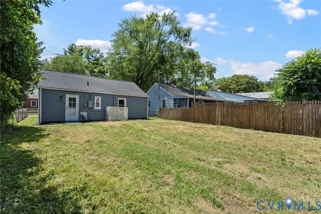 a swimming pool with wooden fence