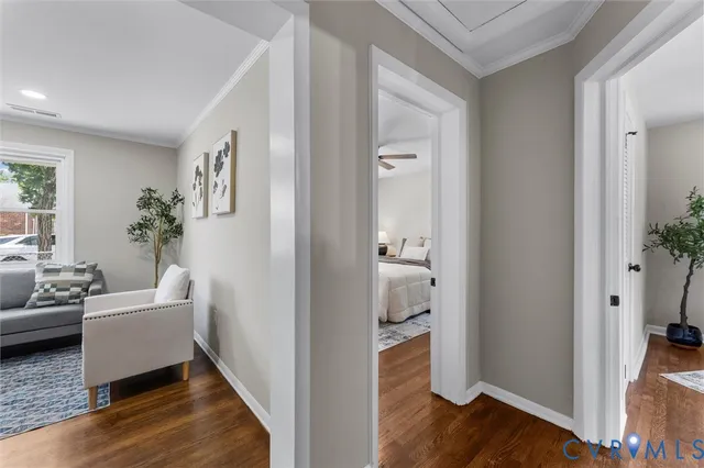 a view of room with furniture and wooden floor