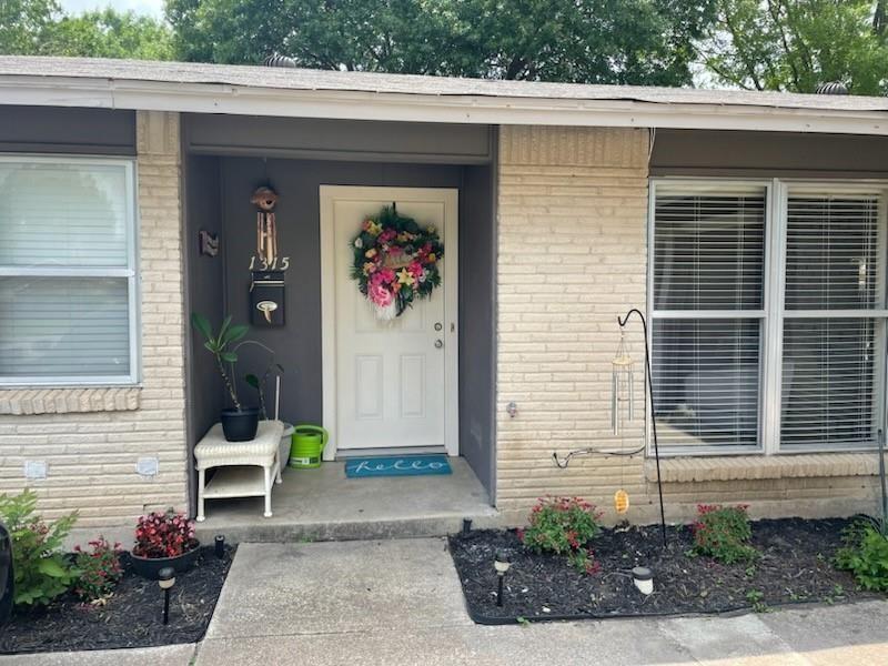 1315 North Floyd Road Richardson, TX 75080 - Photo 2 of 26 a front view of a house with a garage