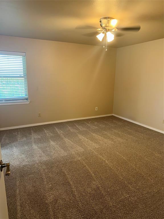 1315 North Floyd Road Richardson, TX 75080 - Photo 21 of 26 an empty room with a fan & a window