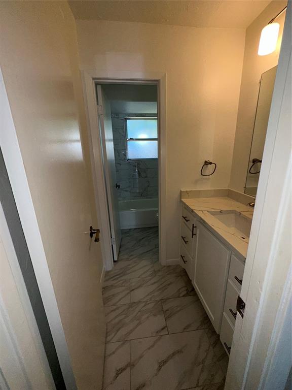 1315 North Floyd Road Richardson, TX 75080 - Photo 23 of 26 a bathroom with a sink a toilet and a mirror
