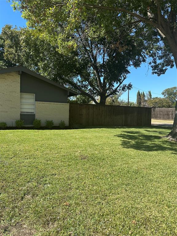 1315 North Floyd Road Richardson, TX 75080 - Photo 3 of 26 a front view of a house with a yard