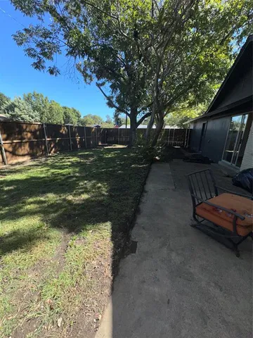 a view of a yard with an outdoor space