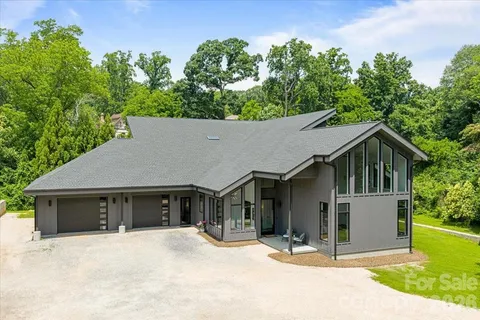 a house with trees in the background