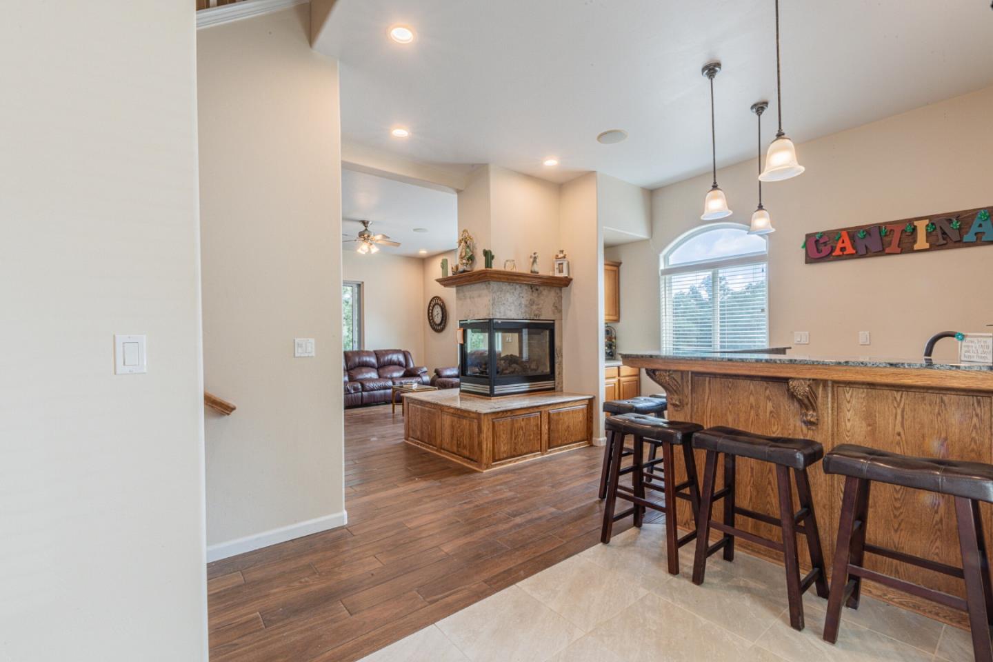 2188 Ridge Rider Road Bradley, CA 93426 - Photo 14 of 47 a kitchen with kitchen island stainless steel appliances a table and chairs in it