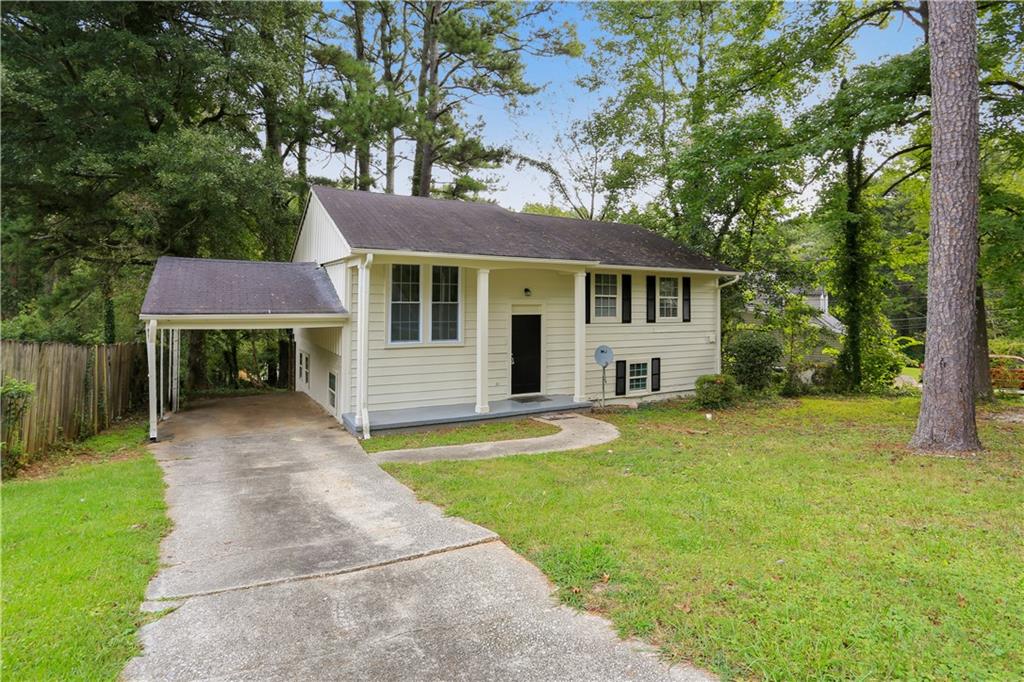 2434 Manassas Lane Decatur, GA 30034 - Photo 1 of 1 a front view of a house with a yard and trees