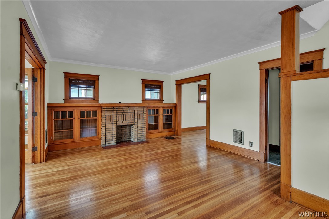 17 Westgate Road Tonawanda, NY 14217 - Photo 9 of 37 From the front entry, the gracious living room greets you with stunning hardwood floors and natural woodwork that extend throughout almost all of this charming home.