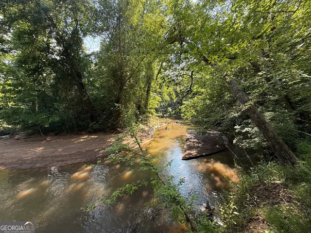 a view of a lake with trees
