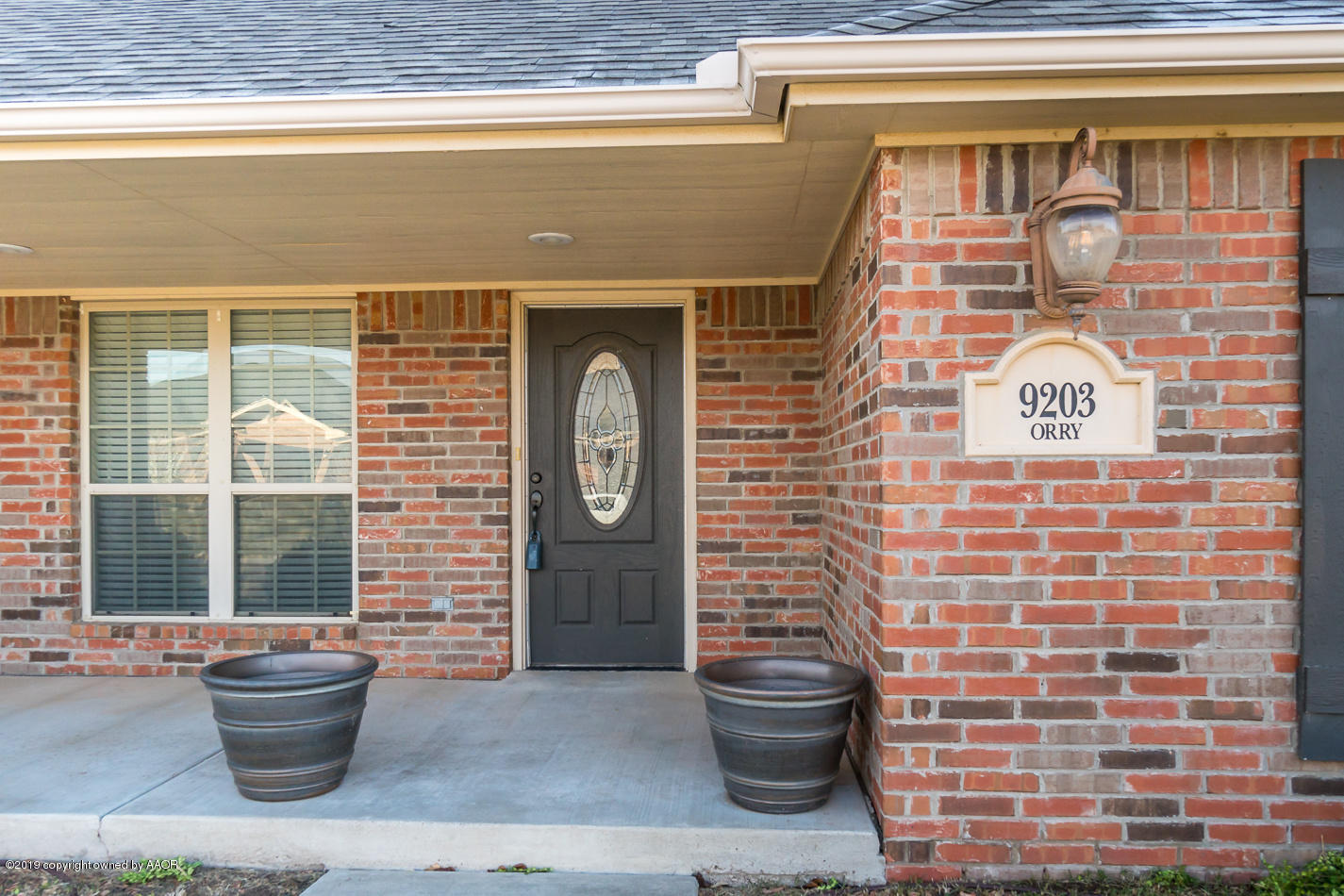 9203 Orry Avenue Amarillo, TX 79119 - Photo 2 of 22 a bathroom with a toilet and a shower