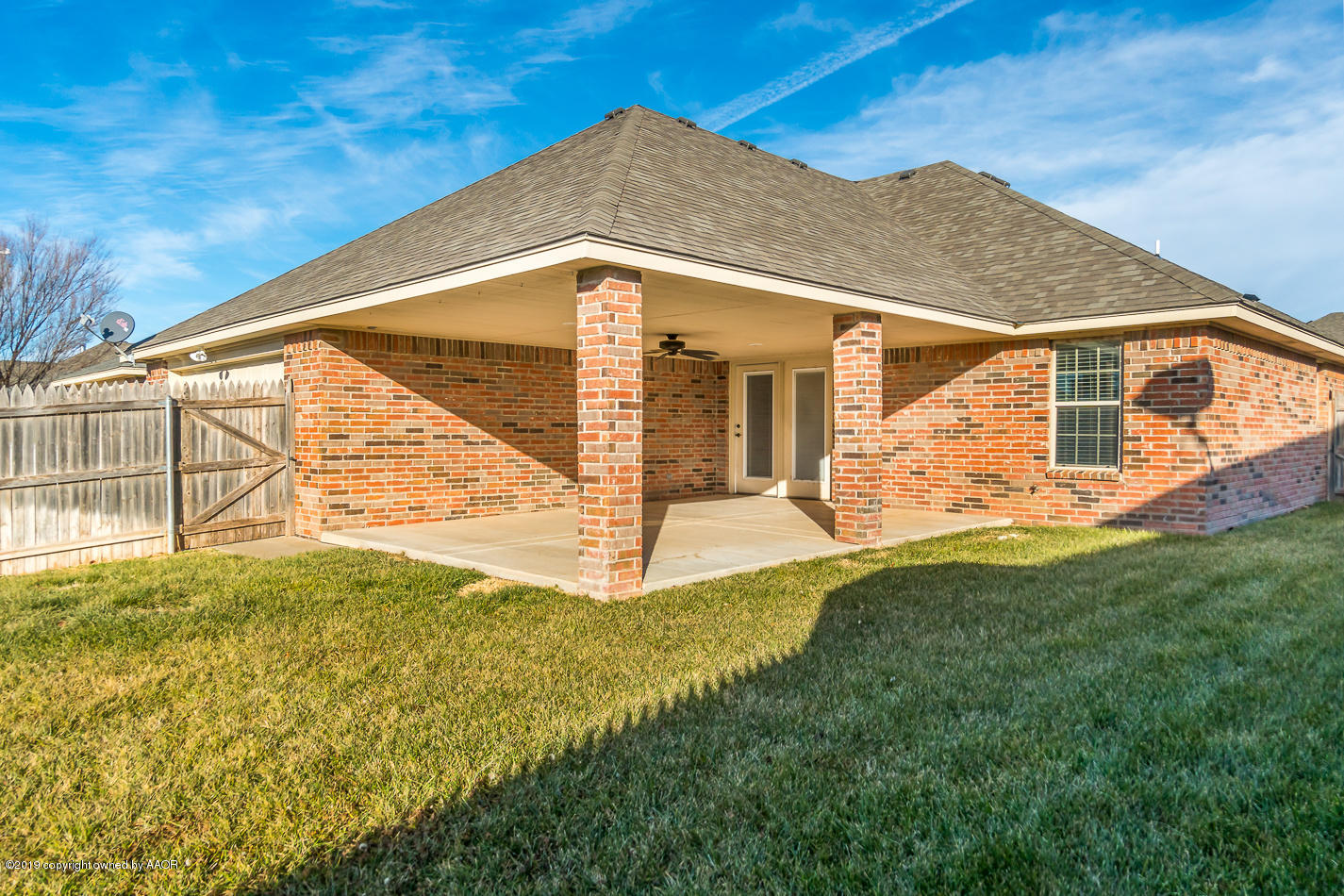 9203 Orry Avenue Amarillo, TX 79119 - Photo 21 of 22 a view of a house with a yard