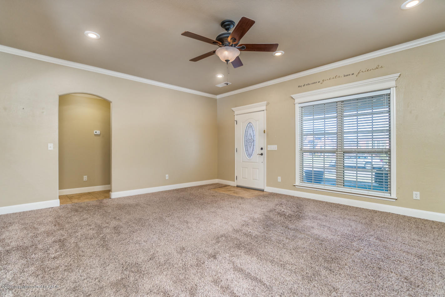 9203 Orry Avenue Amarillo, TX 79119 - Photo 3 of 22 an empty room with fan and windows