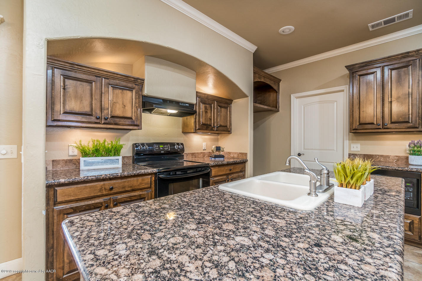 9203 Orry Avenue Amarillo, TX 79119 - Photo 8 of 22 a bathroom with a granite countertop sink and a mirror
