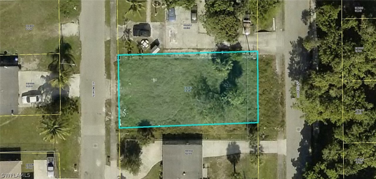 an aerial view of a residential houses with outdoor space