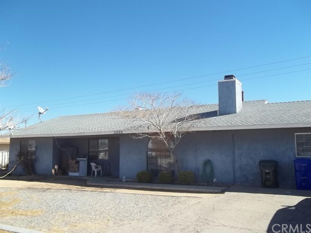 11225 Mohawk Road Apple Valley, CA 92308 - Photo 1 of 1 a front view of a house with a yard