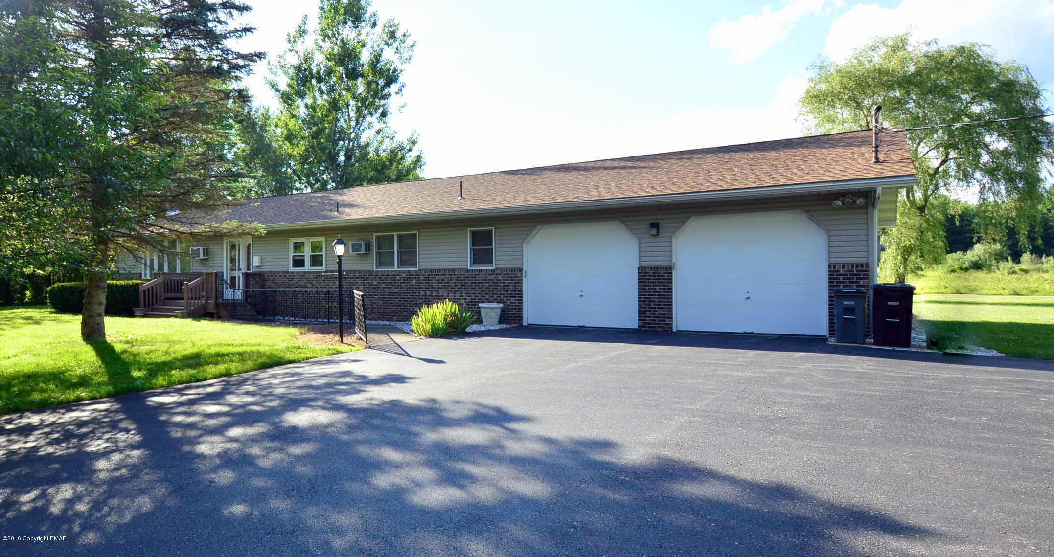 1109 Interchange Road Kunkletown, PA 18058 - Photo 1 of 23 a front view of a house with a yard and garage