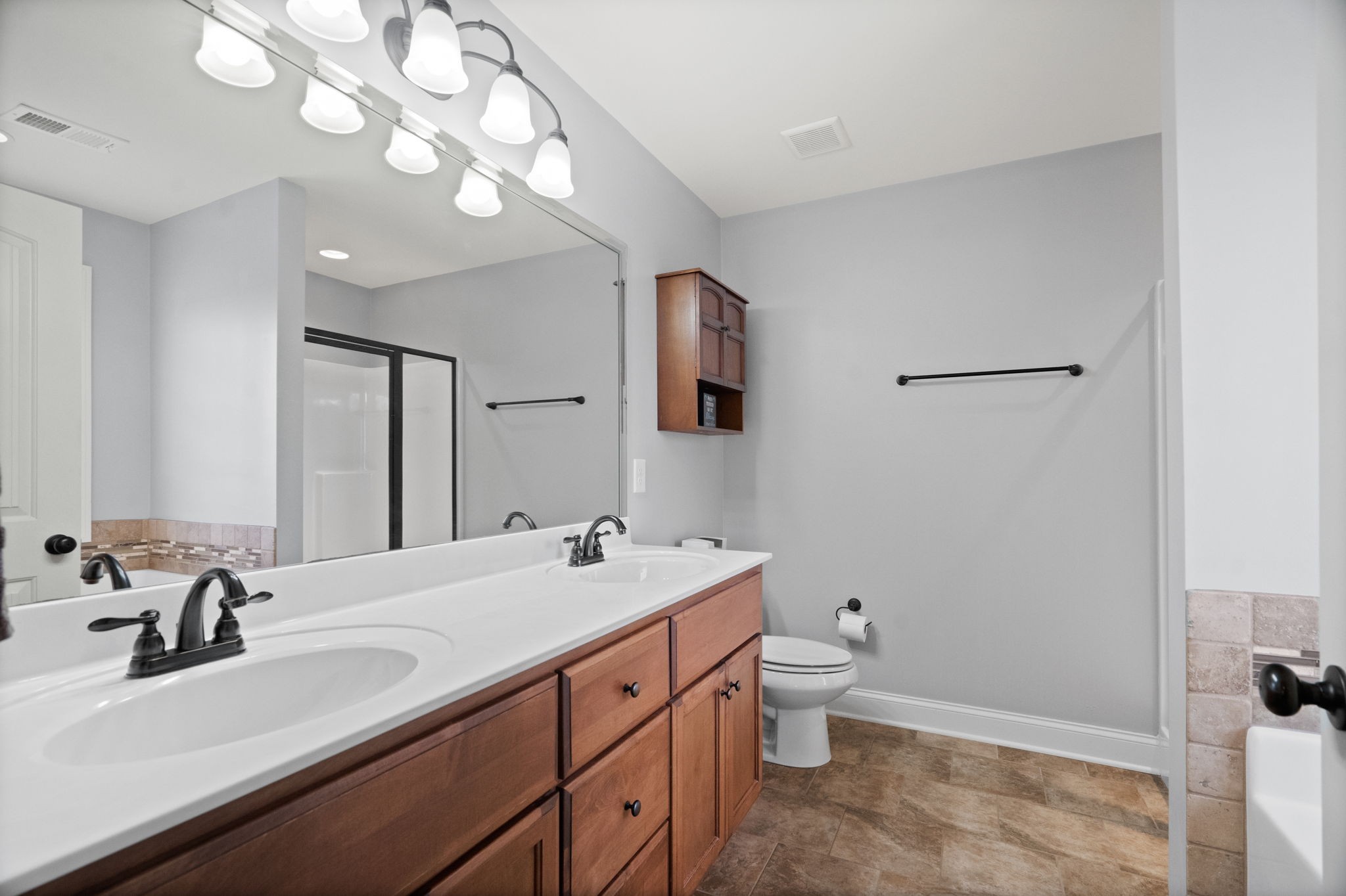 48 Harbor Pointe Lebanon, TN 37087 - Photo 17 of 28 a bathroom with a sink a toilet and a mirror
