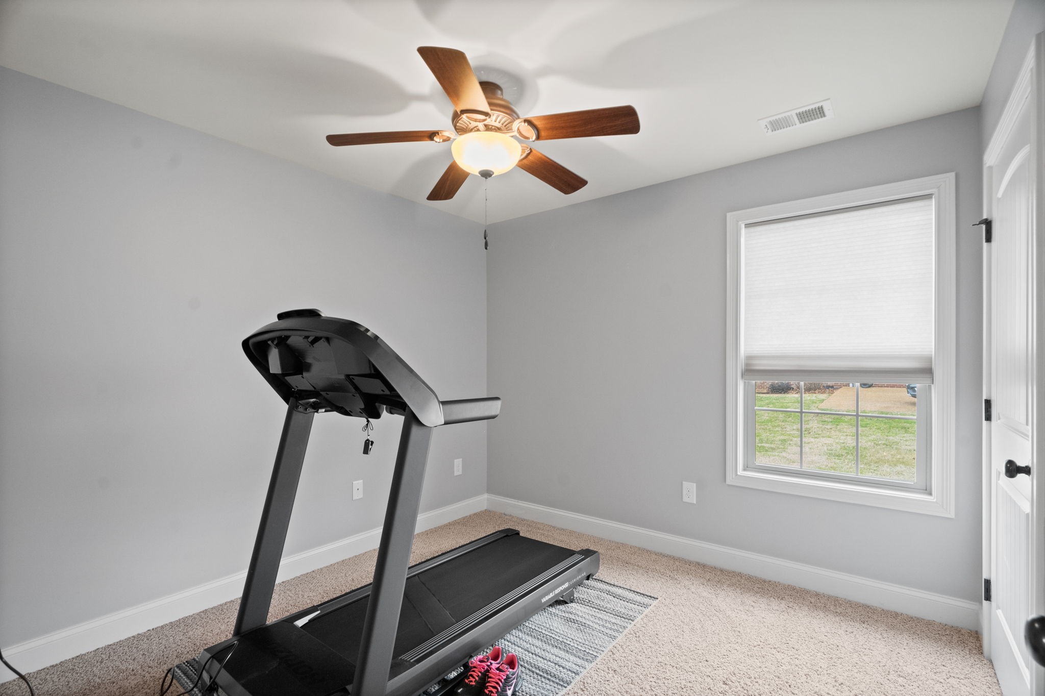 48 Harbor Pointe Lebanon, TN 37087 - Photo 18 of 28 a view of a room with gym equipment and a chandelier