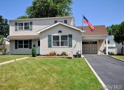 109 Azalea Road Levittown, NY 11756 - Photo 1 of 1 a front view of a house with a yard