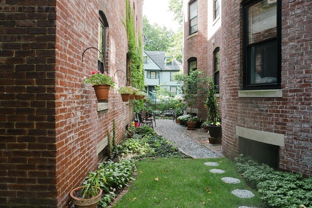 26 Hurlbut Street, Unit 2 Cambridge, MA 02138 - Photo 14 of 17 a view of house with backyard and garden