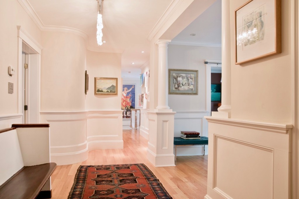 26 Hurlbut Street, Unit 2 Cambridge, MA 02138 - Photo 3 of 17 a hallway with a white cabinets and wooden floor