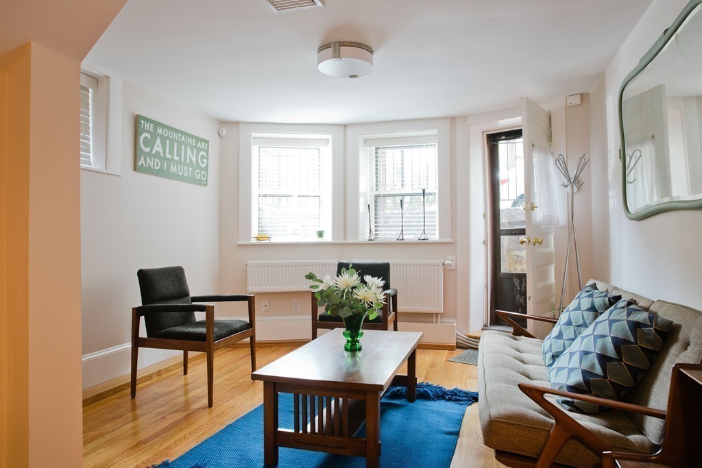 26 Hurlbut Street, Unit 2 Cambridge, MA 02138 - Photo 8 of 17 a living room with furniture and wooden floor