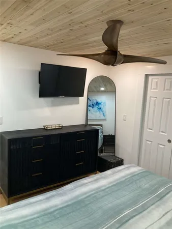 a spacious bathroom with a vanity and a mirror