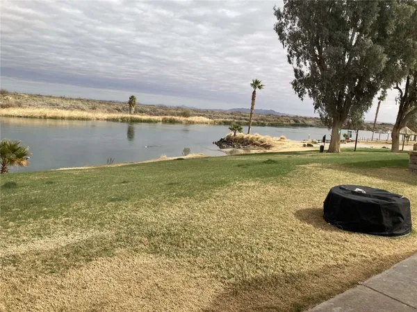 a view of a lake with a big yard
