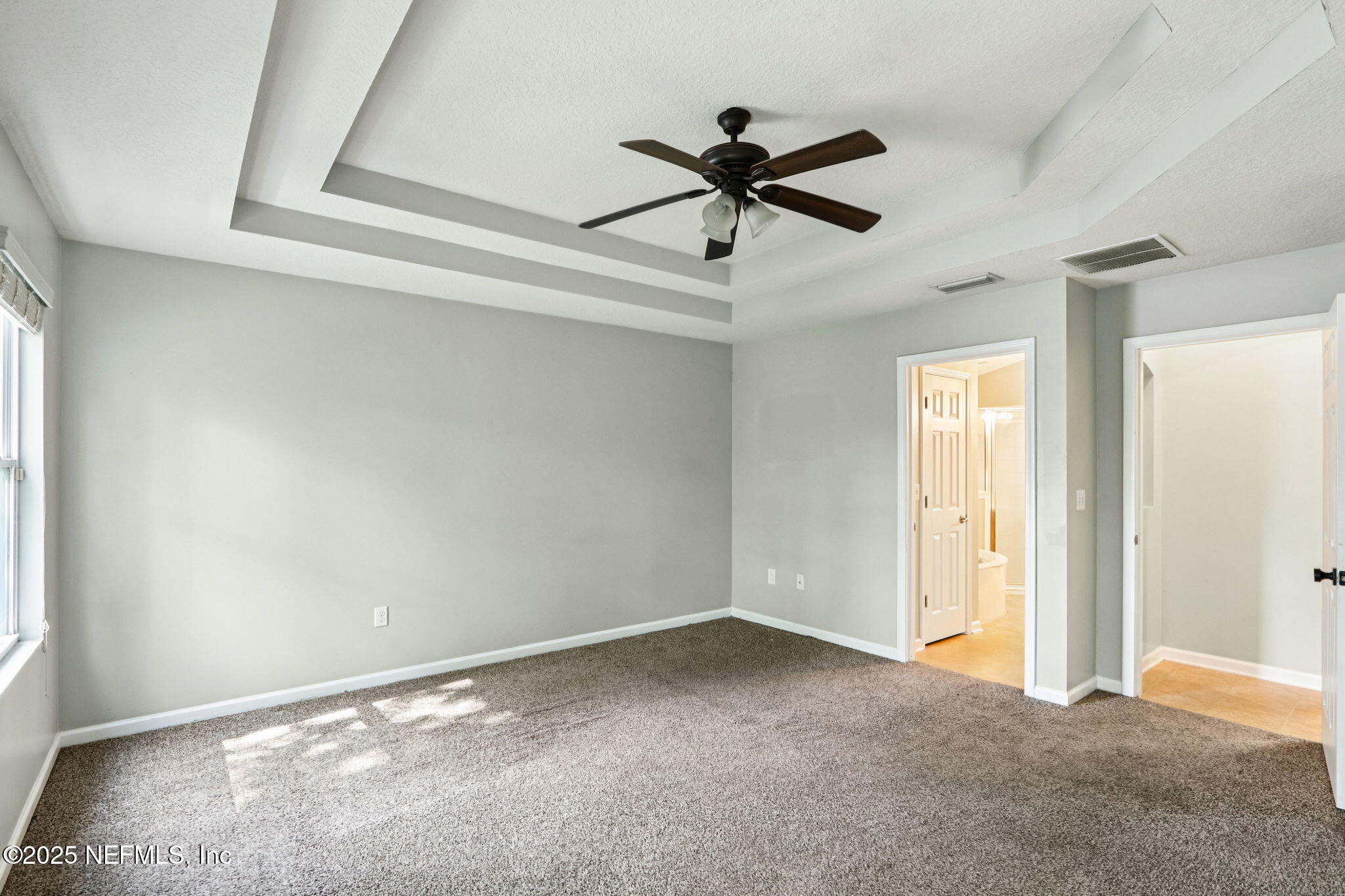 4054 Trail Ridge Road Middleburg, FL 32068 - Photo 13 of 48 a view of a big room with wooden floor and windows in a room