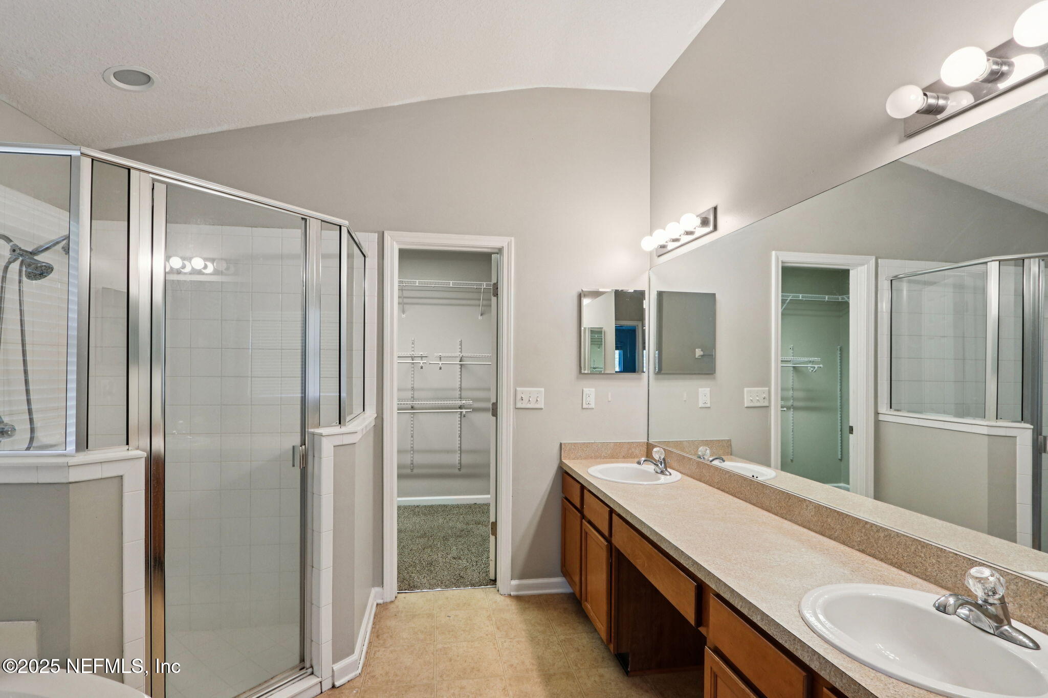 4054 Trail Ridge Road Middleburg, FL 32068 - Photo 14 of 48 a bathroom with a double vanity sink mirror and shower