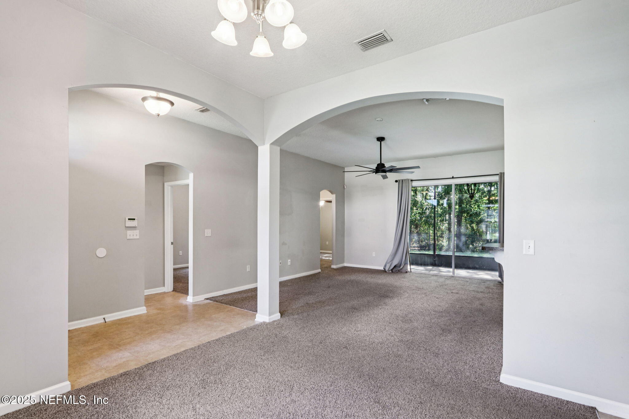 4054 Trail Ridge Road Middleburg, FL 32068 - Photo 20 of 48 wooden floor in an empty room with a mirror