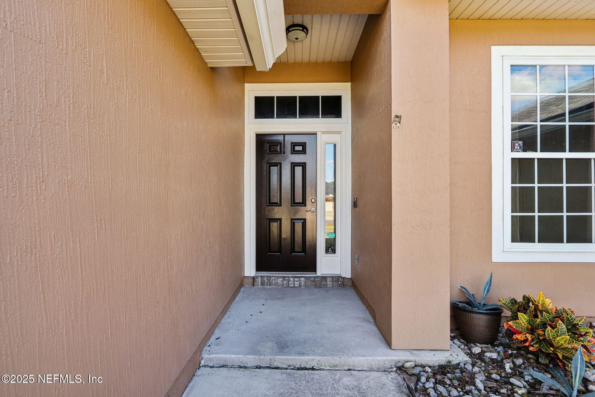 4054 Trail Ridge Road Middleburg, FL 32068 - Photo 2 of 48 a view of a hallway with wooden walls and windows